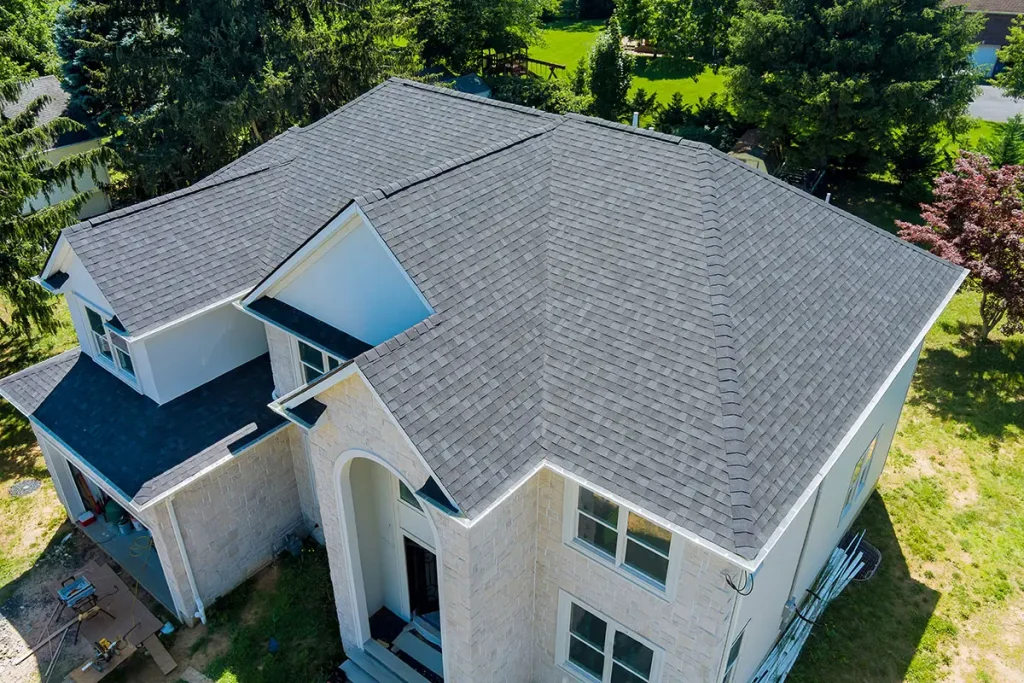 Aerial view of asphalt shingles roofing construction