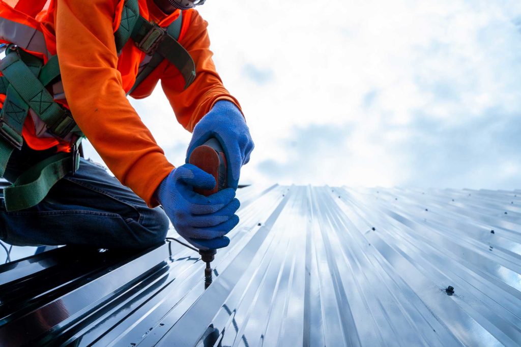 Contractor working on a roof outside