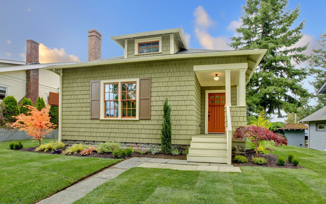 Green small craftsman style renovated house