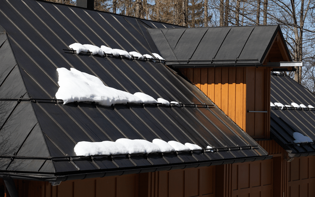 Metal roof of house with snow