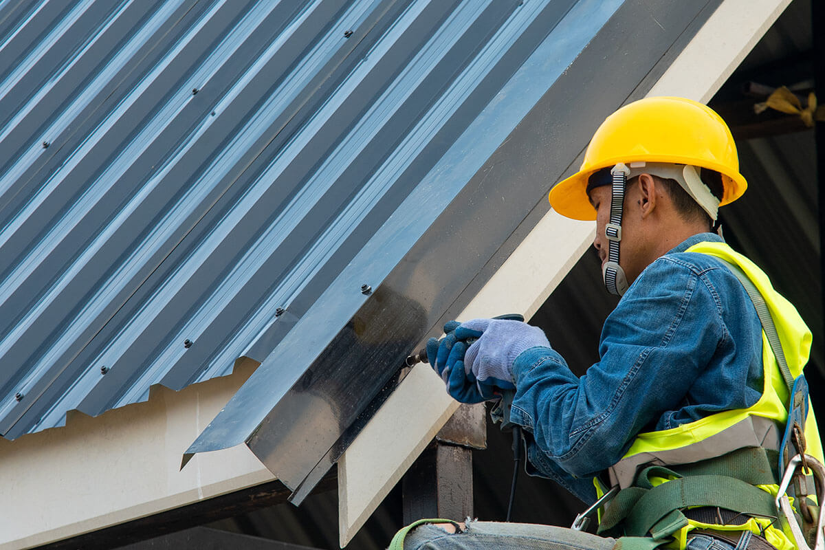 Technician working on roof structure