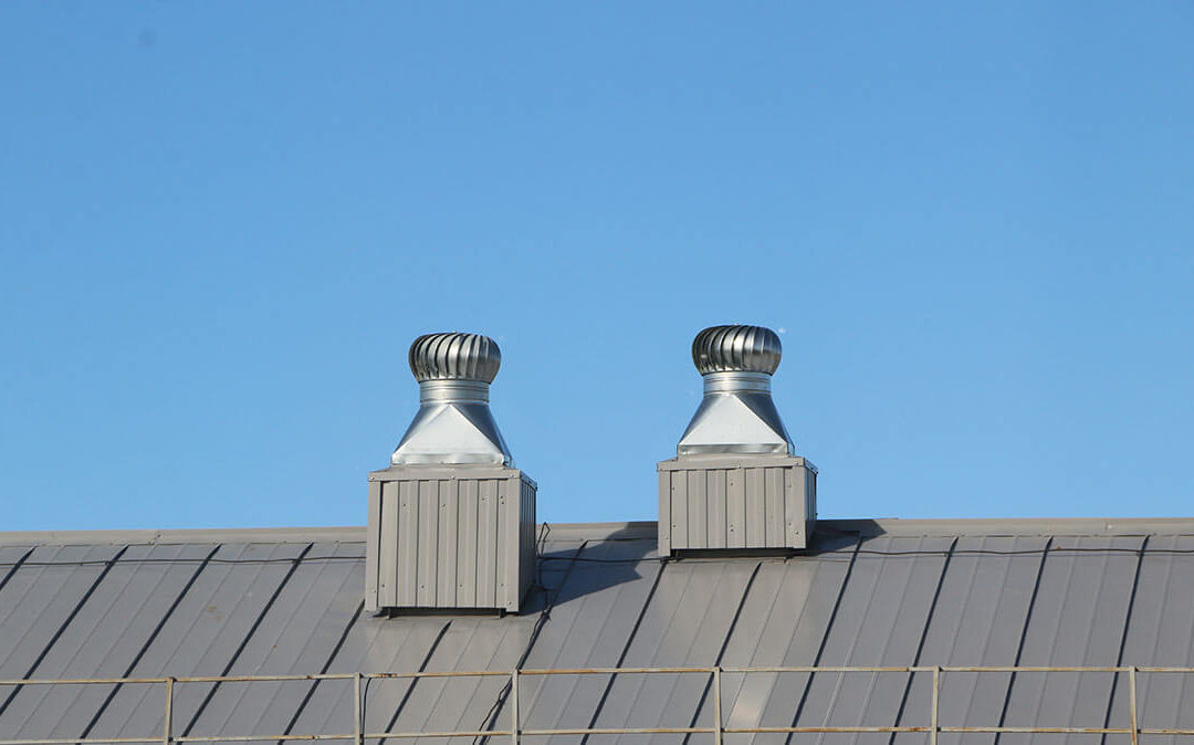 shiny metal air ventilation on roof rotates