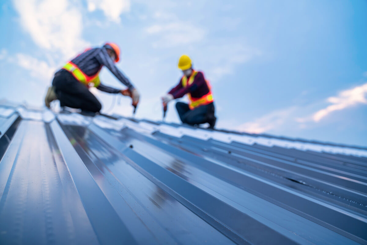 Selective focus roof, construction worker safety wear Selective focus roof, construction worker safety wear